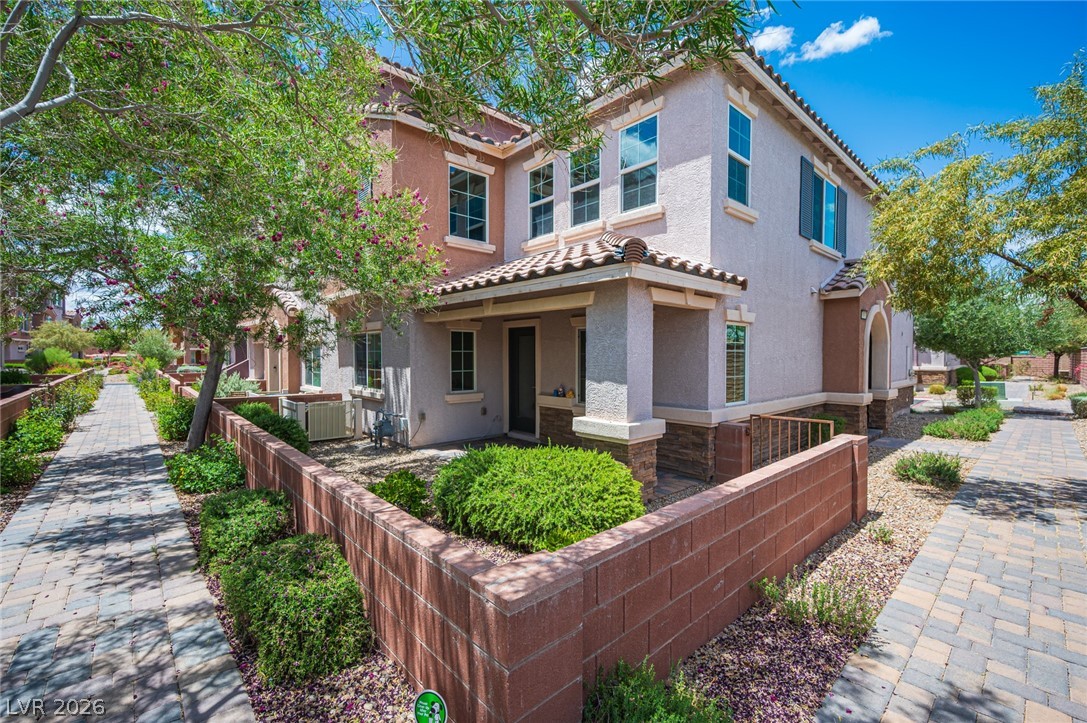 9916 Sable Point Street Las Vegas, NV 89178 - Photo 1 of 73 A terracotta-tiled roof crowns this stucco-finished townhome, complemented by an inviting porch and a well-tended garden bed.