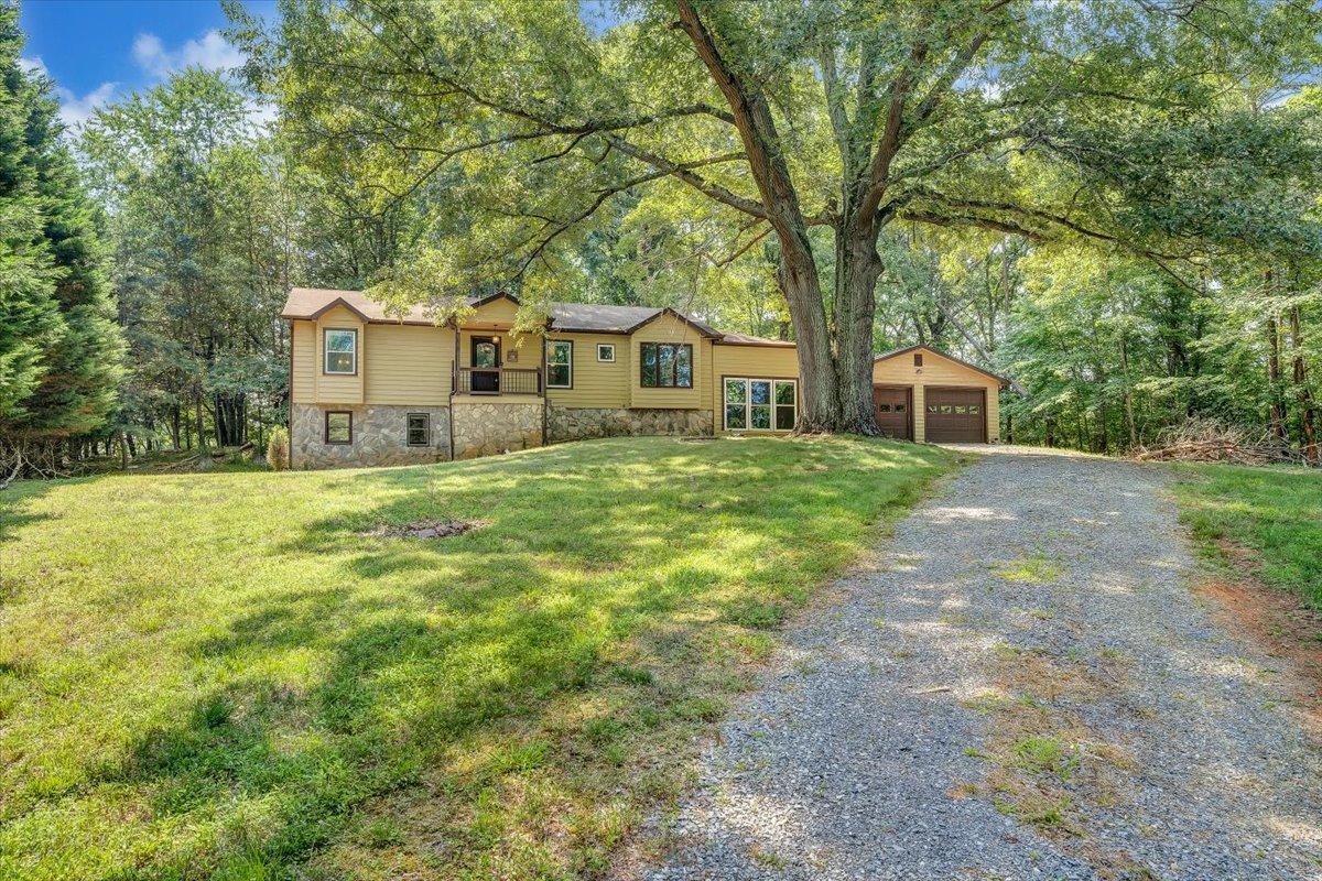 80 Walnut Landing Circle Hardy, VA 24101 - Photo 2 of 34 a house with huge green field in front of it