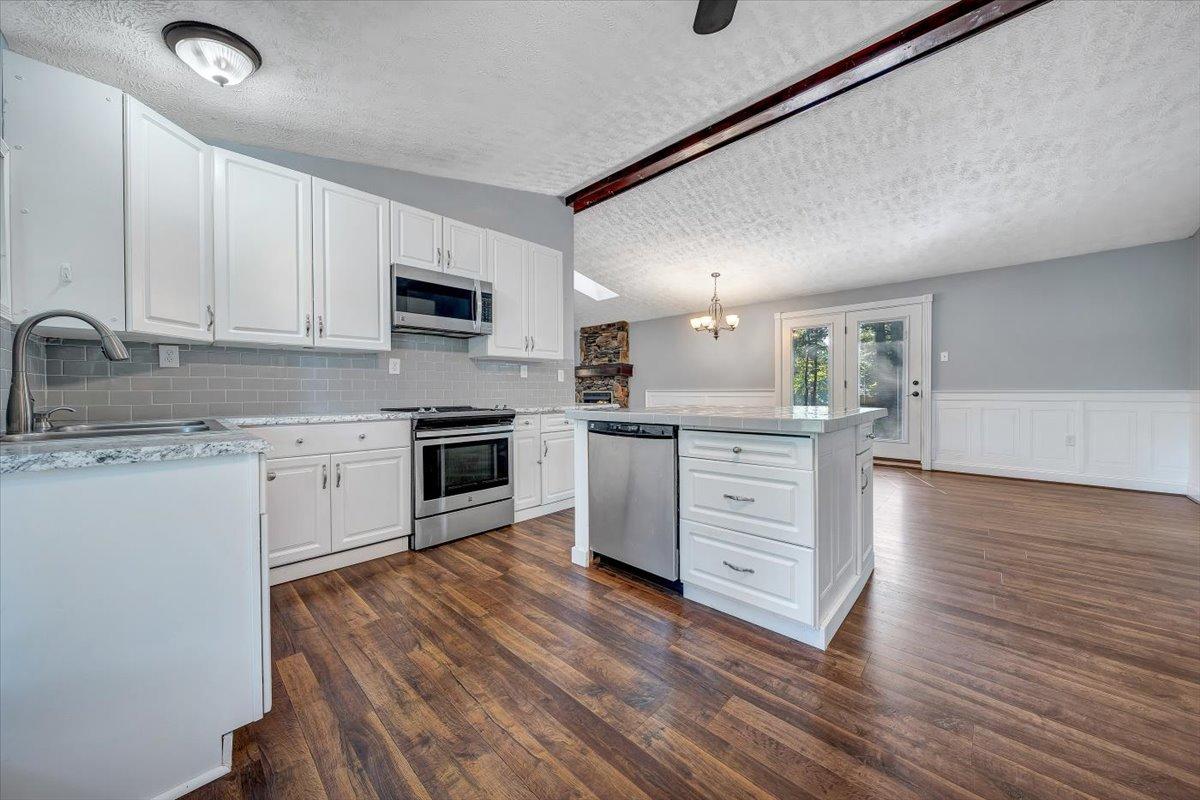 80 Walnut Landing Circle Hardy, VA 24101 - Photo 17 of 34 a kitchen with a white cabinets and wooden floor