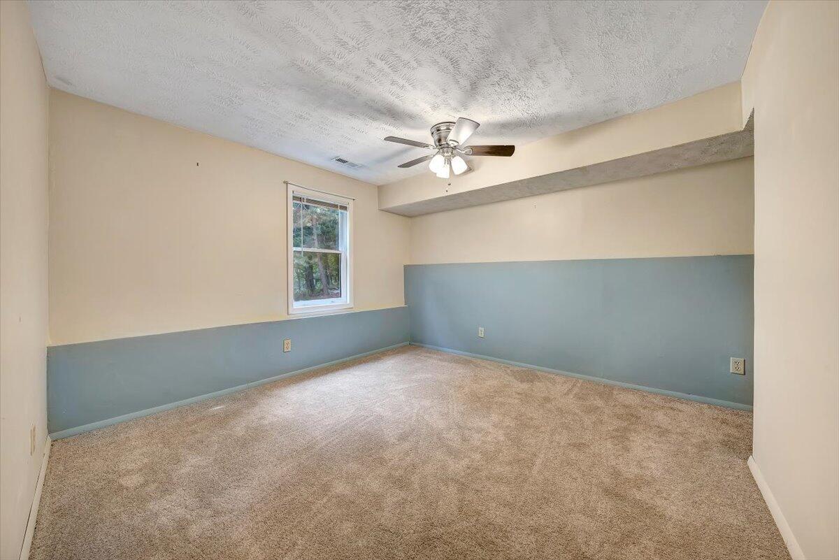 80 Walnut Landing Circle Hardy, VA 24101 - Photo 27 of 34 an empty room with a window and a ceiling fan