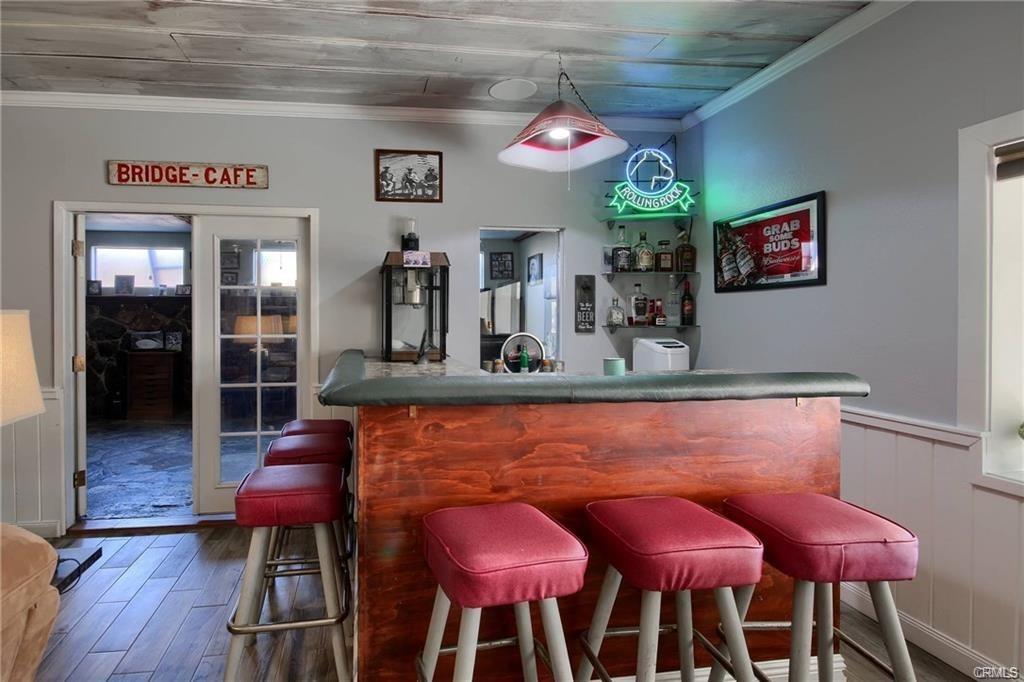 7428 Hornitos Road Hornitos, CA 95325 - Photo 11 of 46 a view of a dining room with furniture and wooden floor