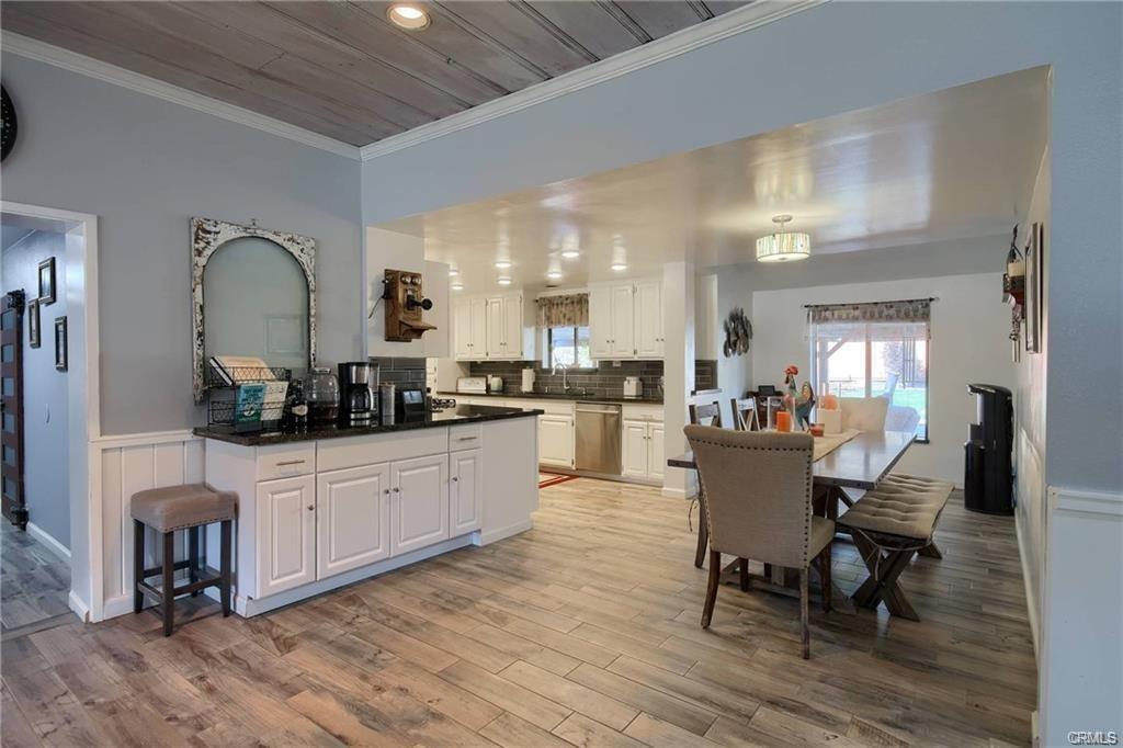 7428 Hornitos Road Hornitos, CA 95325 - Photo 12 of 46 a large white kitchen with sink and chairs