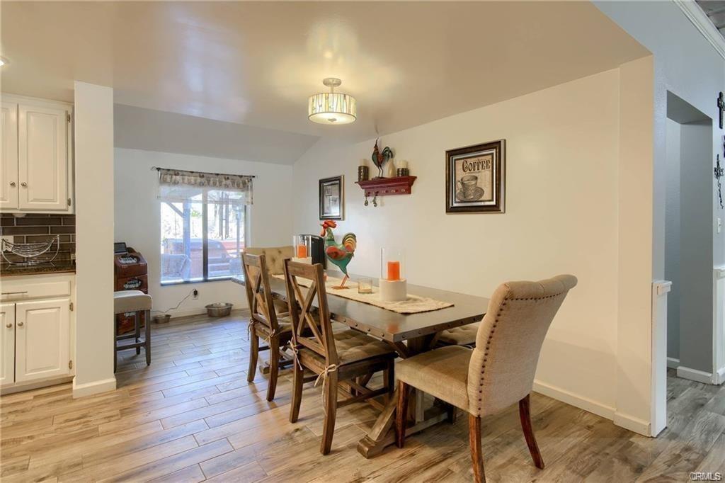 7428 Hornitos Road Hornitos, CA 95325 - Photo 15 of 46 a view of a dining room with furniture and wooden floor