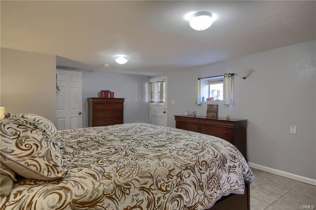 7428 Hornitos Road Hornitos, CA 95325 - Photo 19 of 46 a bedroom with a bed and a dresser