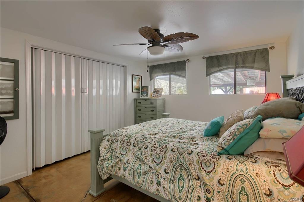 7428 Hornitos Road Hornitos, CA 95325 - Photo 21 of 46 a bedroom with a bed and a window