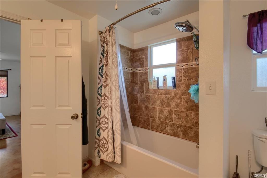 7428 Hornitos Road Hornitos, CA 95325 - Photo 24 of 46 a bathroom with a bathtub and a shower