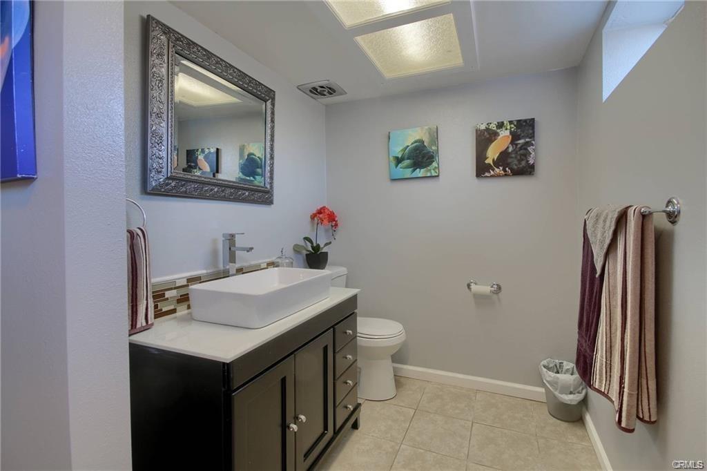 7428 Hornitos Road Hornitos, CA 95325 - Photo 26 of 46 a bathroom with a sink mirror and toilet
