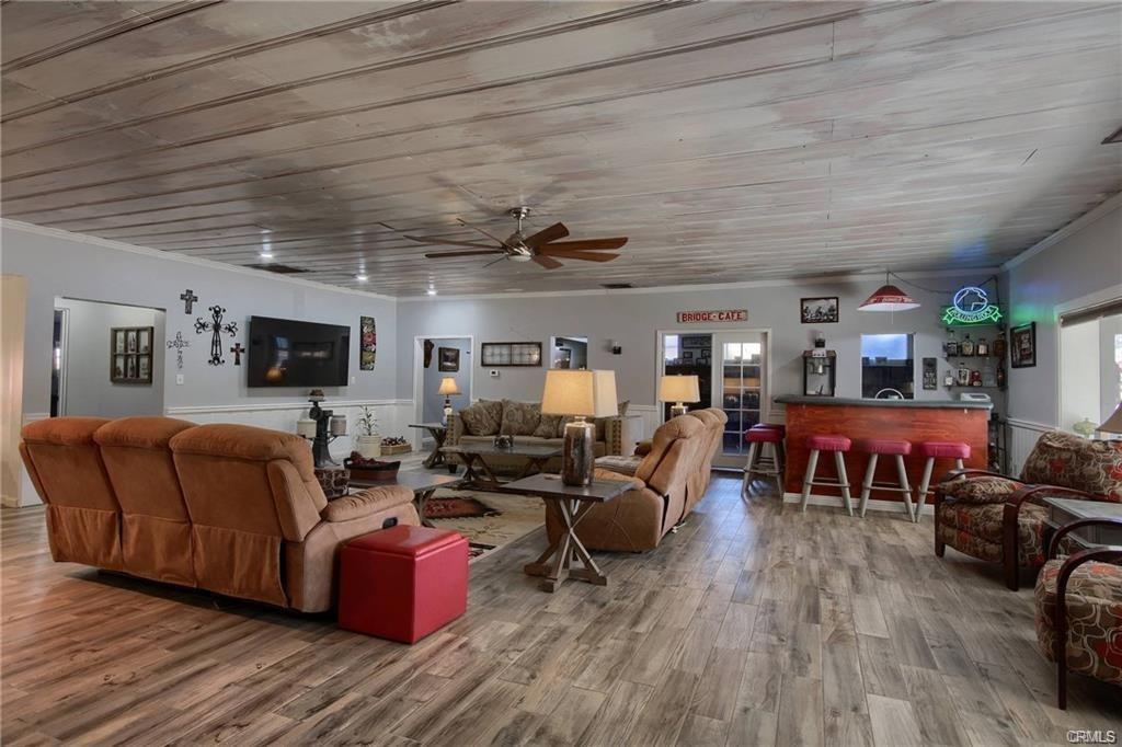 7428 Hornitos Road Hornitos, CA 95325 - Photo 8 of 46 a living room with furniture and a flat screen tv