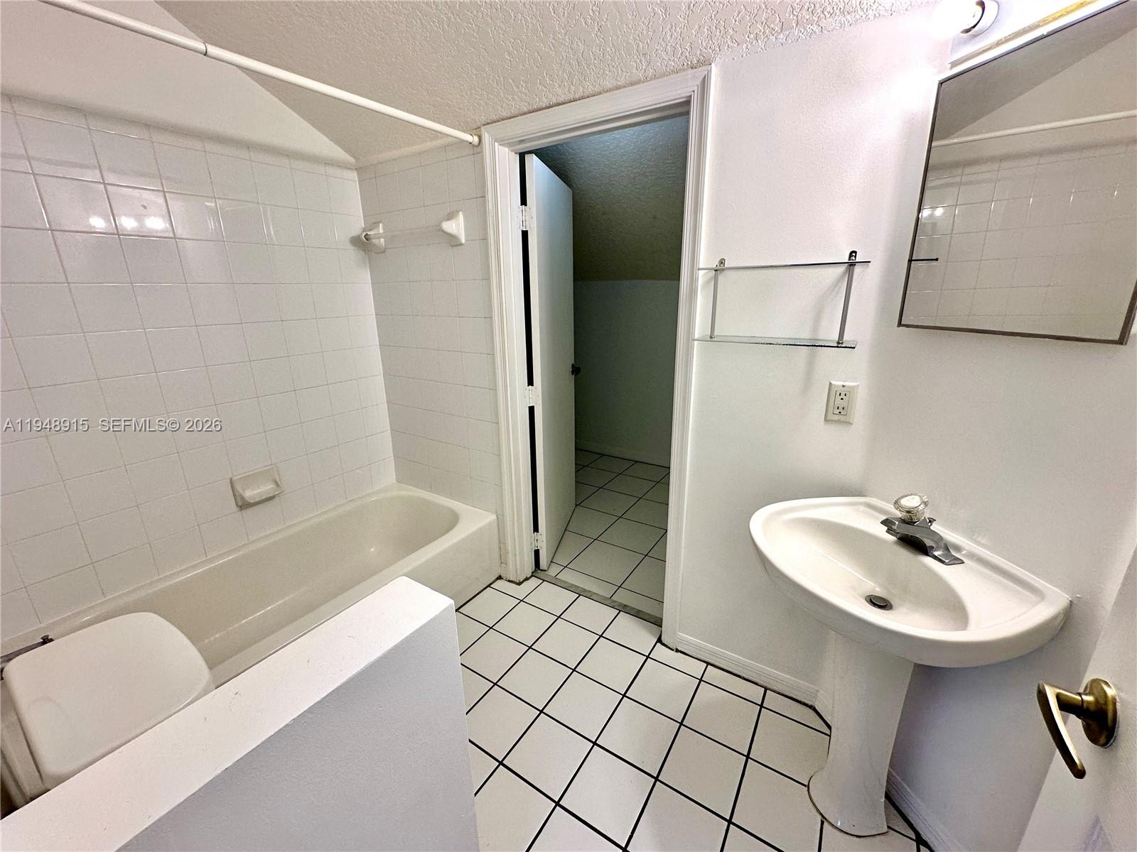 1013 Via Jardin Riviera Beach, FL 33418 - Photo 11 of 18 a bathroom with a sink toilet and shower