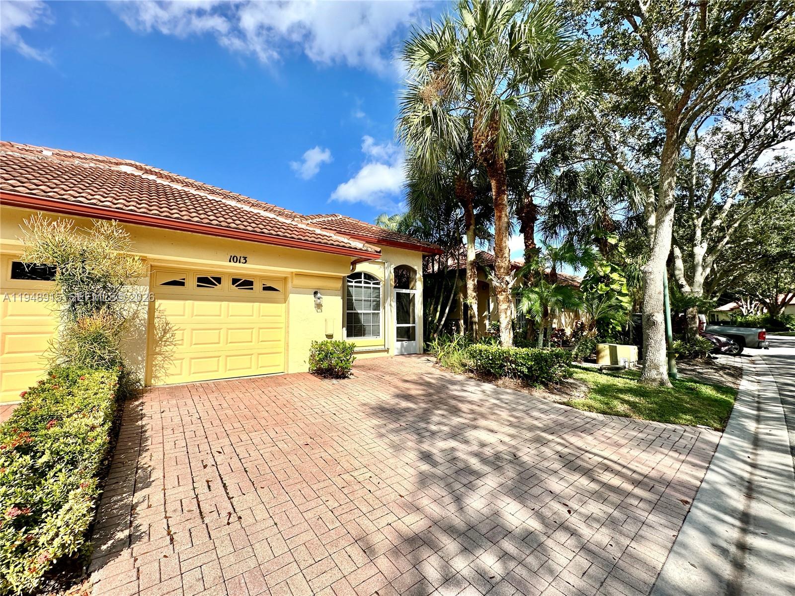1013 Via Jardin Riviera Beach, FL 33418 - Photo 3 of 18 a view of a house with a patio