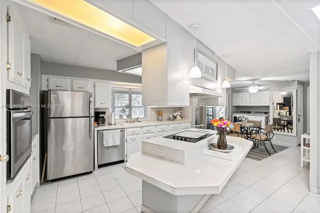 a view of a dining room with furniture large window and wooden floor