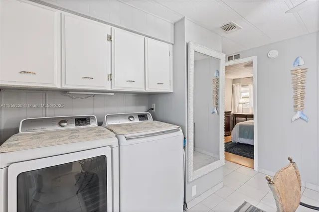 a bathroom with a sink a mirror and shower