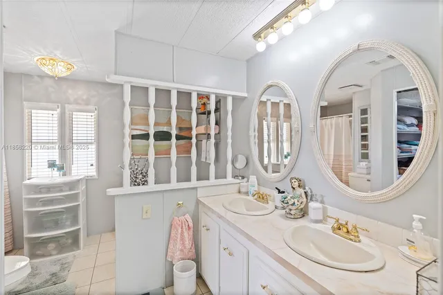 a bathroom with a bathtub sink and mirror