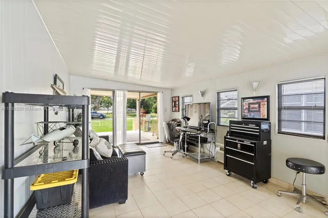 a view of a porch with furniture and garden