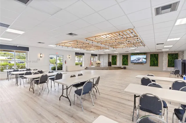 a view of a swimming pool with a patio and ocean view