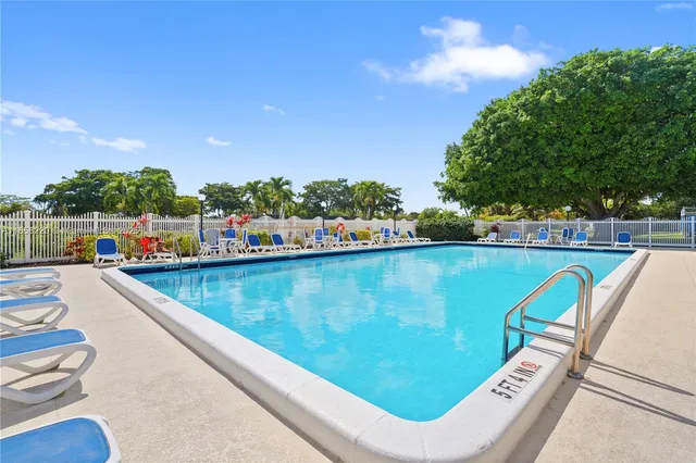 a view of a table and chairs under an umbrella