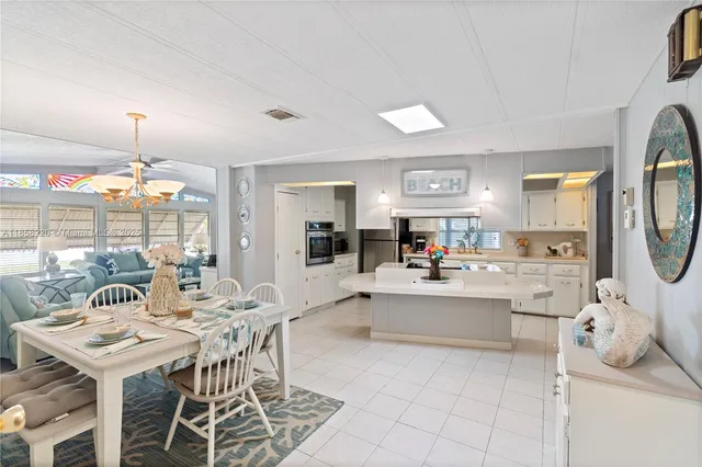 a view of a dining room and a kitchen island
