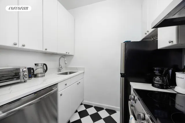 a kitchen with a sink and cabinets