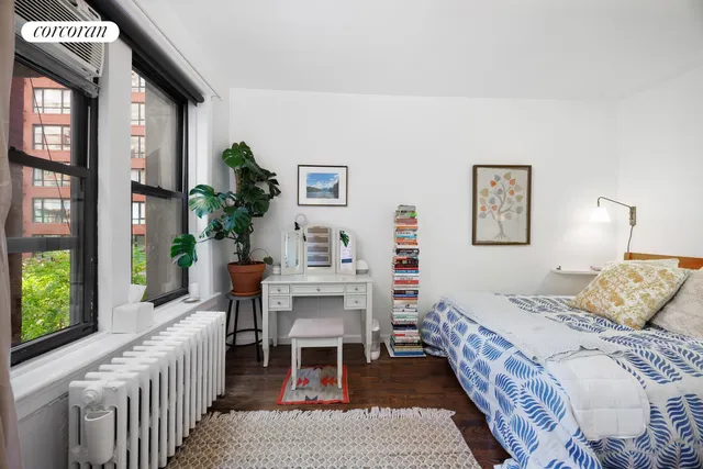 a bedroom with a bed and a table