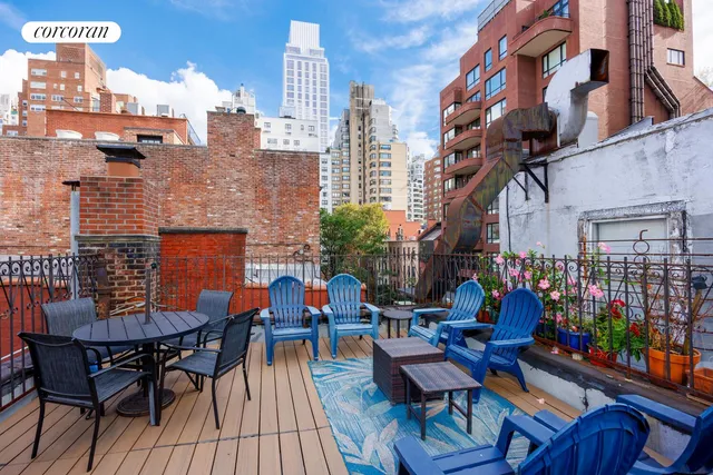 a view of a chairs and table on the deck