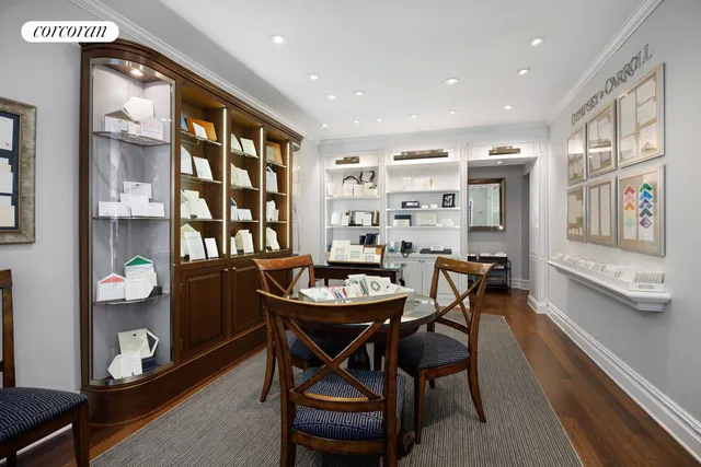 a view of a dining room with furniture and window