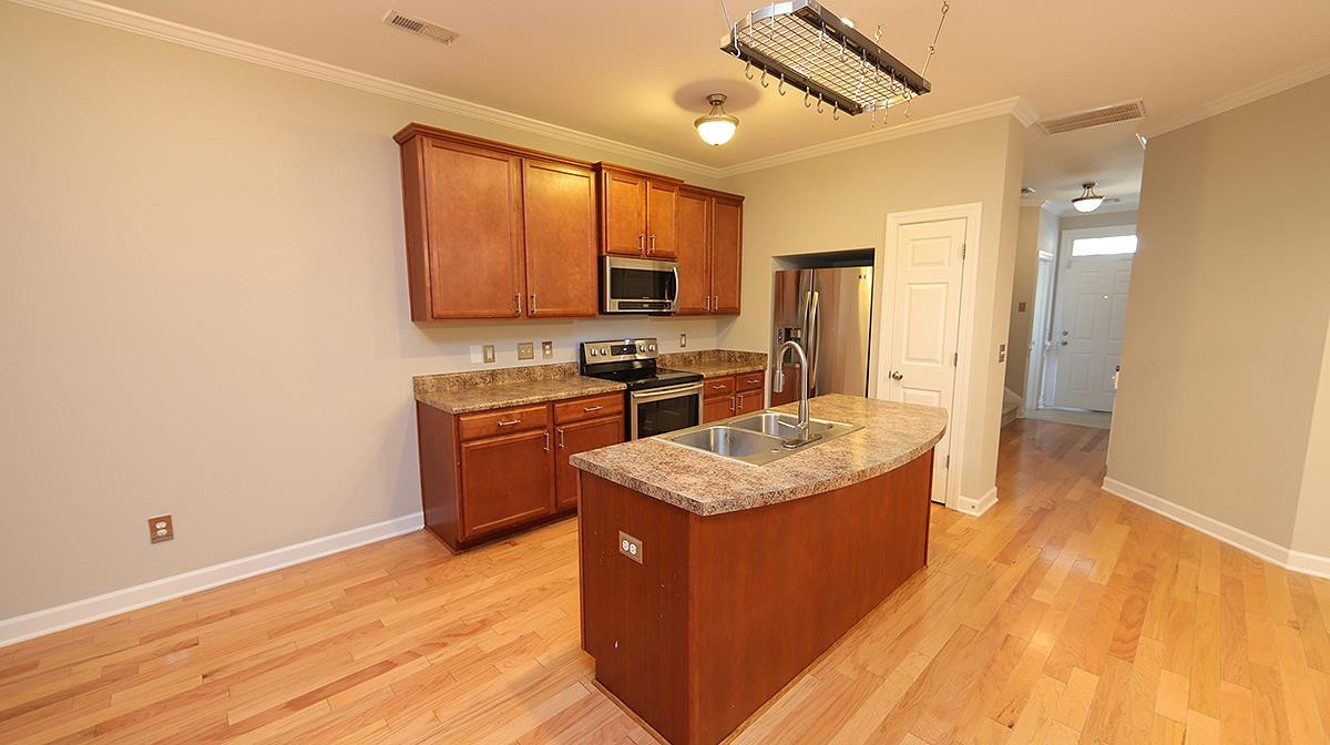 2023 Fieldhouse Avenue Raleigh, NC 27603 - Photo 2 of 13 Island kitchen is open to the main living area Kitchen