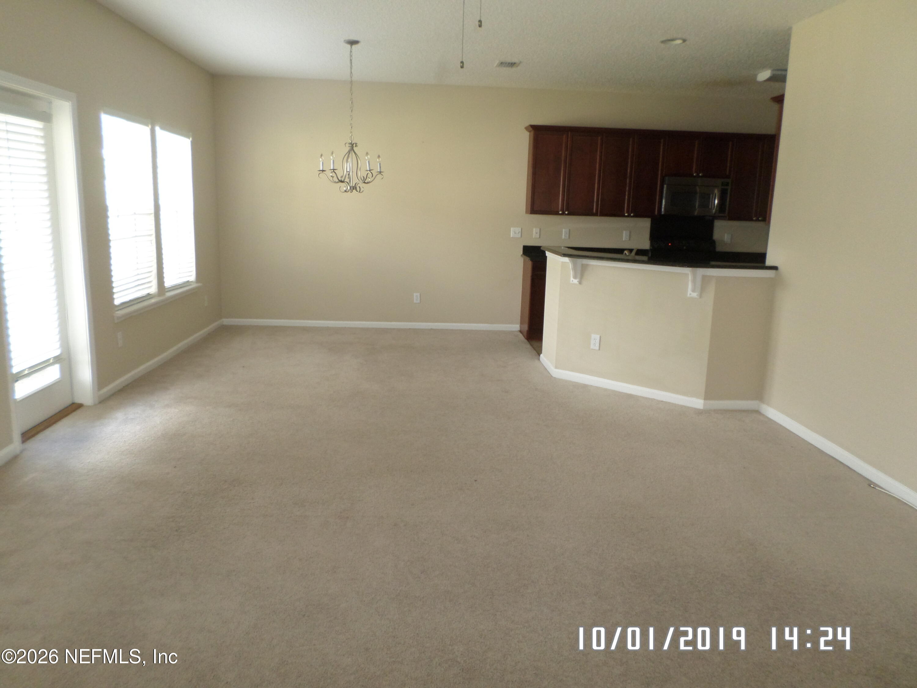 11807 Templeton Road Jacksonville, FL 32258 - Photo 11 of 18 Living area and dining room