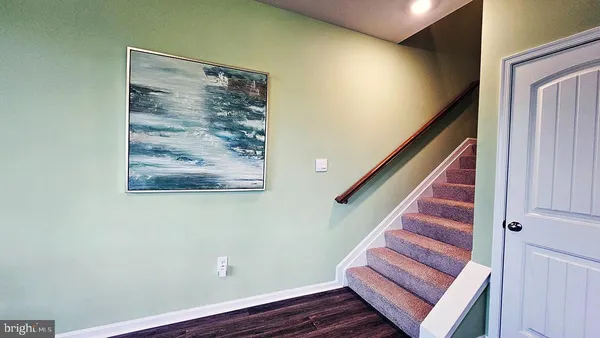 a view of entryway with wooden floor