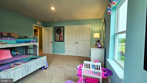 a living room with baby crib furniture and a baby crib