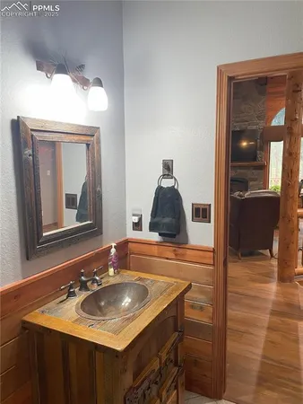 a bathroom with a sink and a mirror