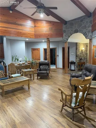 a living room with furniture and a fireplace