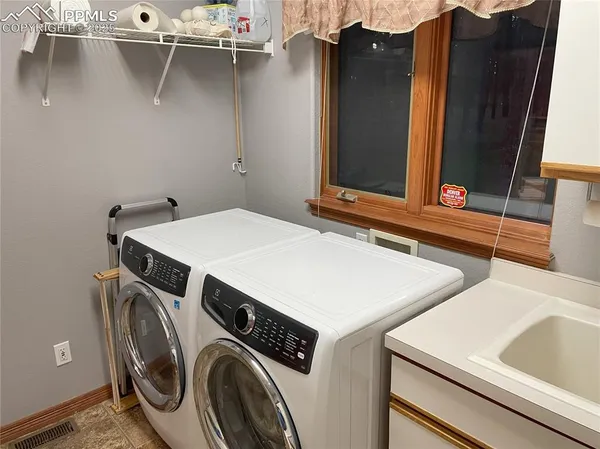 a utility room with dryer and washer