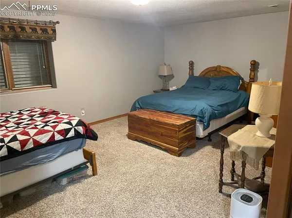 a bedroom with bed and a window