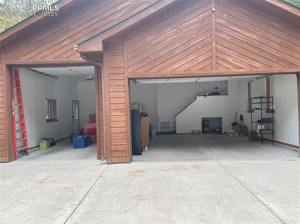 a view of storage and utility room with racks on the wall