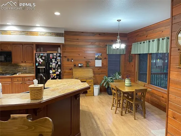a kitchen with a table and chairs in it