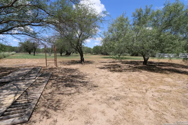 a view of a road with a big yard