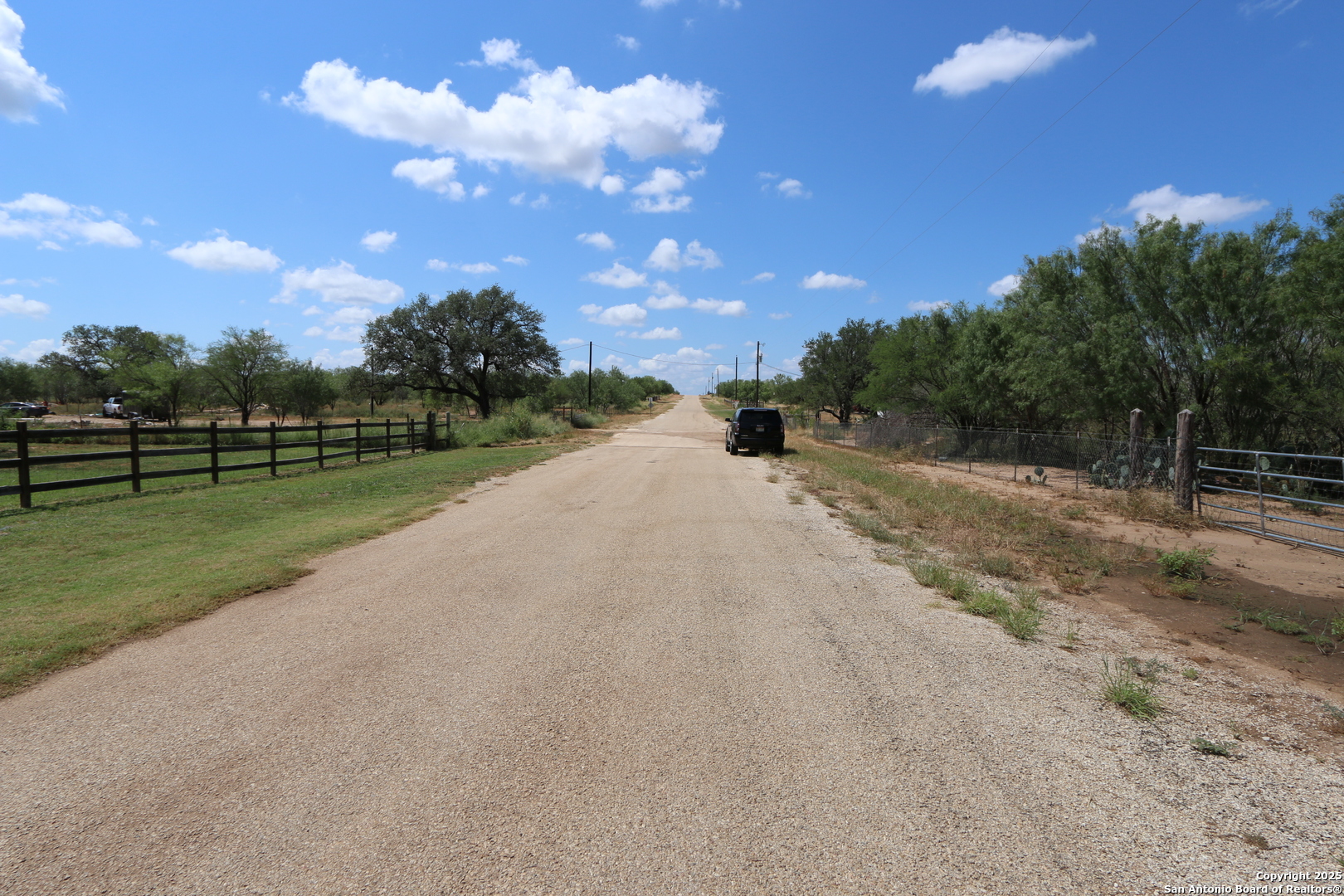 125 County Road 2666 Devine, TX 78016 - Photo 9 of 9 a view of a road with a yard