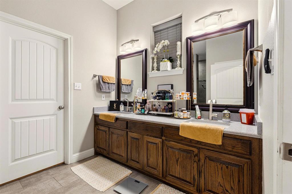 1517 Bennett Road Howe, TX 75459 - Photo 15 of 40 Bathroom featuring double vanity and light wood-type flooring