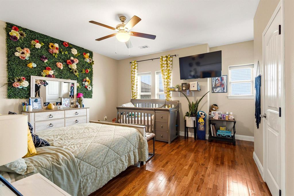 1517 Bennett Road Howe, TX 75459 - Photo 20 of 40 Bedroom featuring hardwood / wood-style floors and a ceiling fan