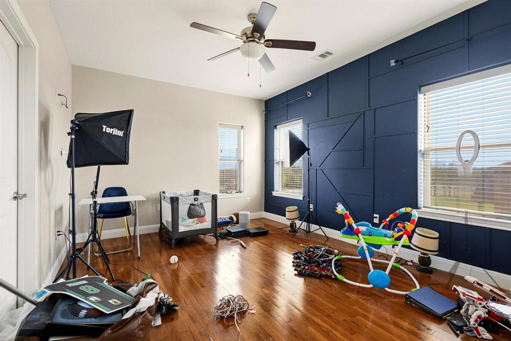 1517 Bennett Road Howe, TX 75459 - Photo 22 of 40 Recreation room featuring ceiling fan and hardwood / wood-style flooring