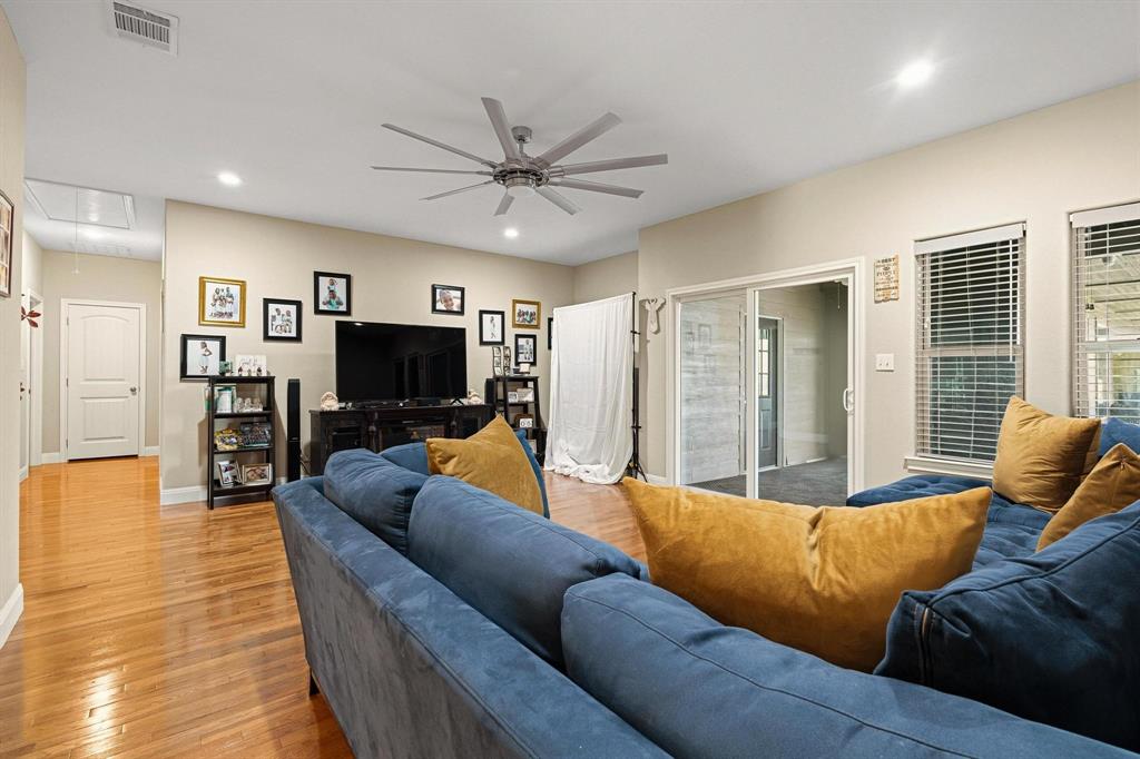 1517 Bennett Road Howe, TX 75459 - Photo 26 of 40 Living area with a ceiling fan, wood finished floors, and recessed lighting