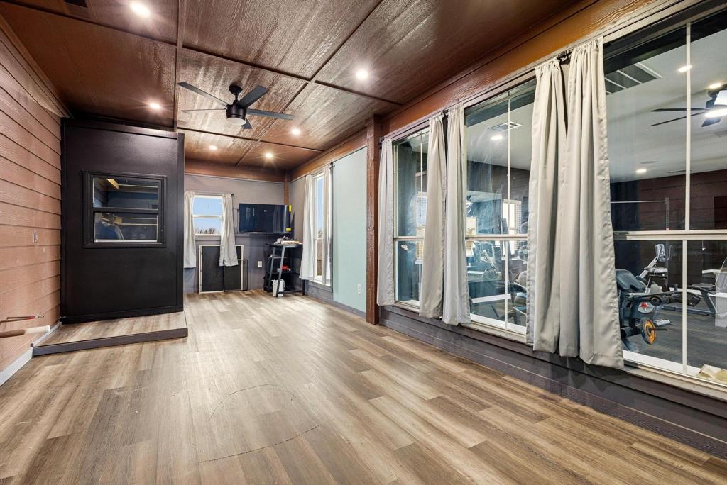 1517 Bennett Road Howe, TX 75459 - Photo 27 of 40 Unfurnished office featuring a ceiling fan, light wood-type flooring, wood ceiling, recessed lighting, and wooden walls