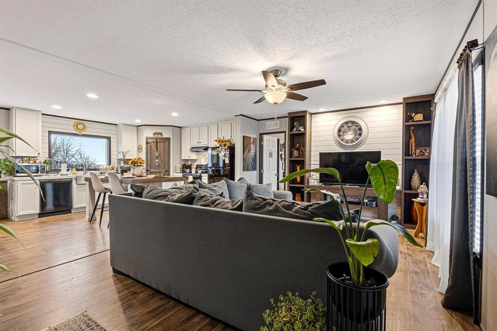 1517 Bennett Road Howe, TX 75459 - Photo 36 of 40 Living room featuring wood finished floors, ceiling fan, a textured ceiling, and recessed lighting