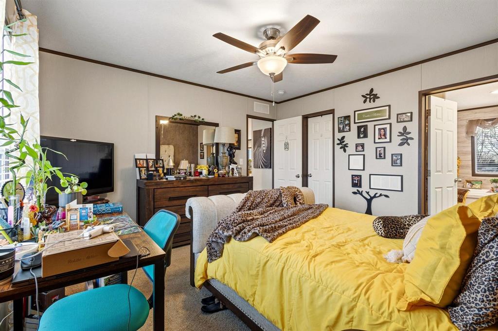1517 Bennett Road Howe, TX 75459 - Photo 38 of 40 Carpeted bedroom featuring crown molding and a ceiling fan