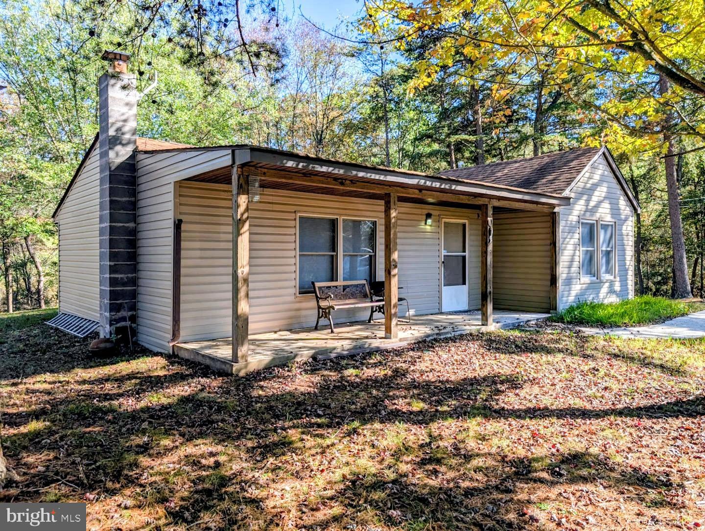 939 Collins Road Artemas, PA 17211 - Photo 1 of 43 a backyard of a house with yard and trees