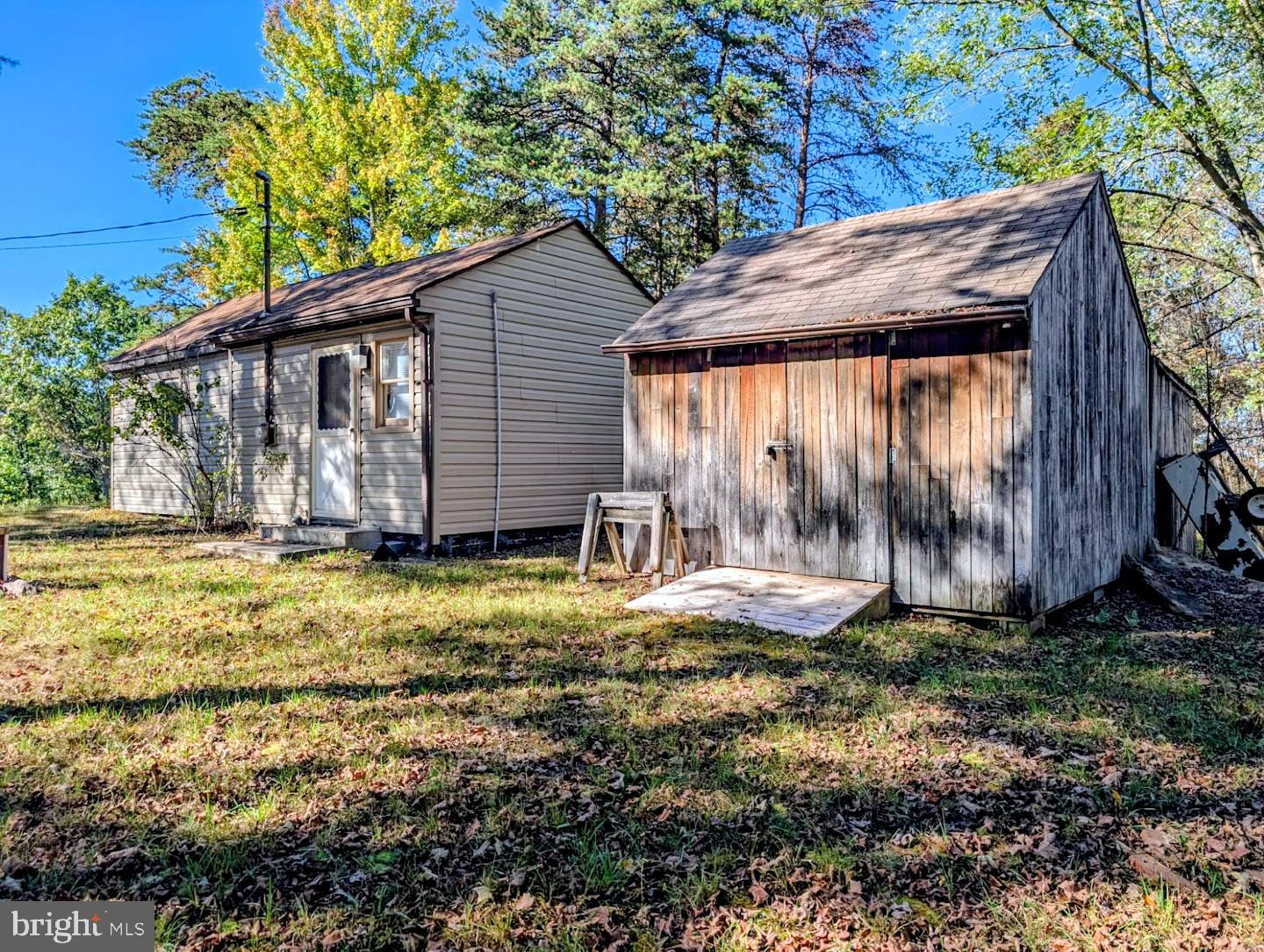 939 Collins Road Artemas, PA 17211 - Photo 25 of 43 a backyard of a house with yard and outdoor seating