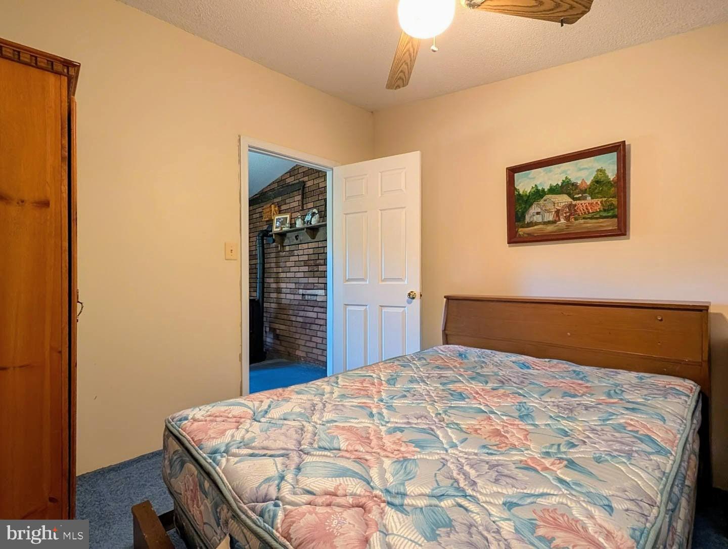 939 Collins Road Artemas, PA 17211 - Photo 6 of 43 a bedroom with a bed and a dresser