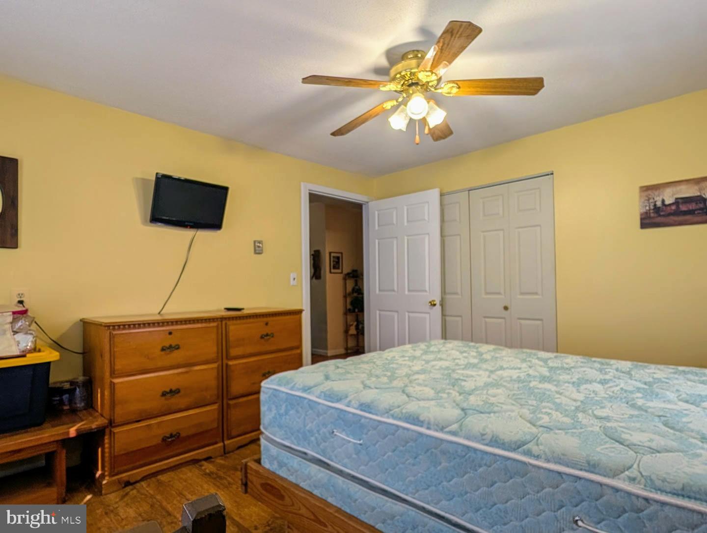 939 Collins Road Artemas, PA 17211 - Photo 10 of 43 a bedroom with a bed and a television