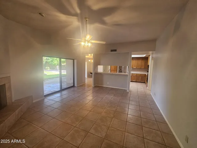 a view of a kitchen with a sink and a window