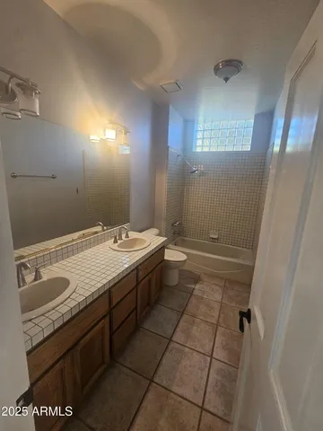 a bathroom with a sink a vanity and mirror